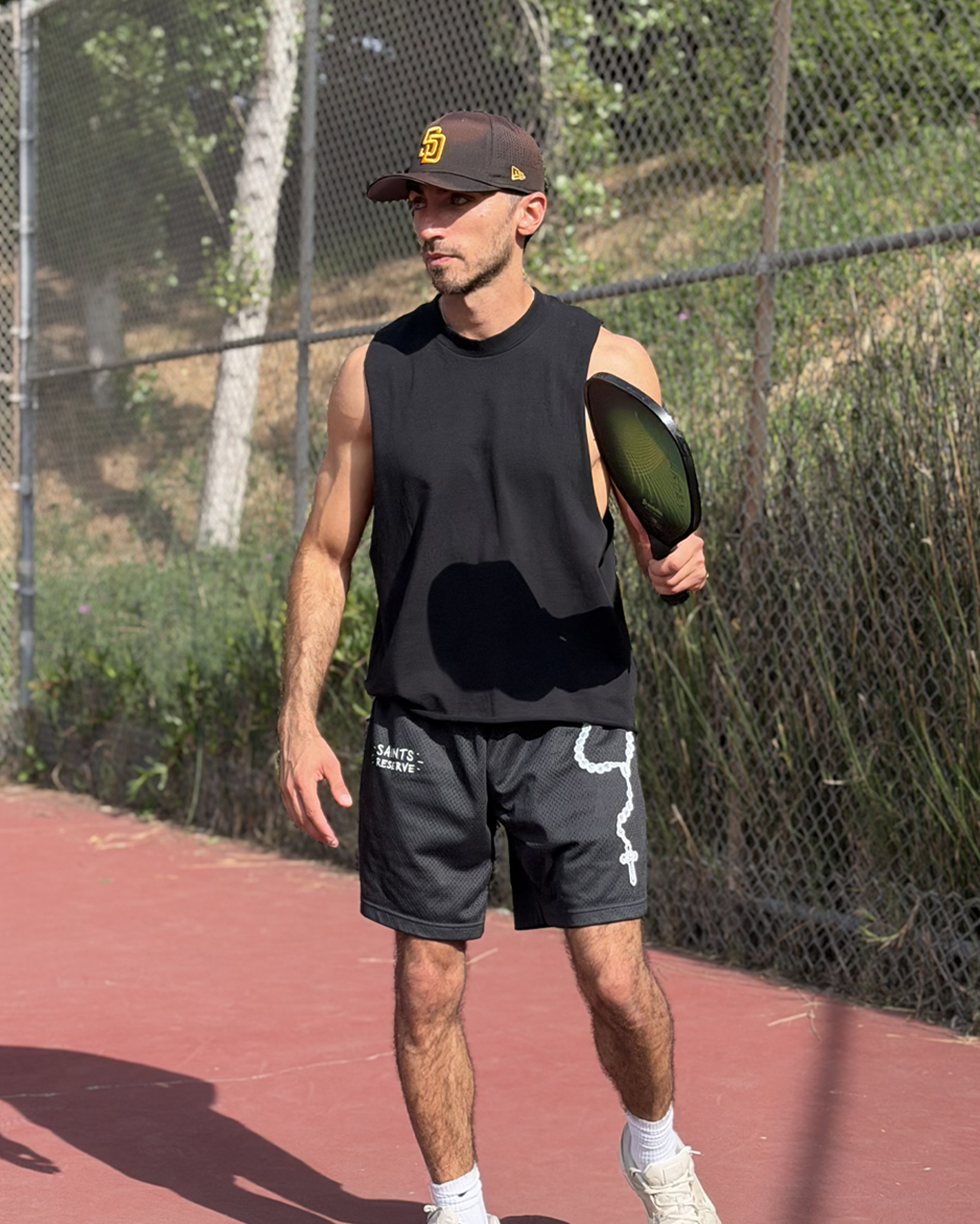 The Rosary Shorts on a court in San Diego
